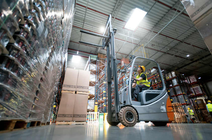 forklift operating over warehouse floor coating